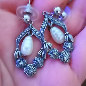 Ornate sterling silver earrings with real pearls